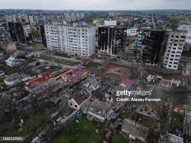 In this aerial view, two destroyed apartment buildings are seen next to an area of heavily damaged houses on April 21, 2022 in Borodianka, Ukraine.