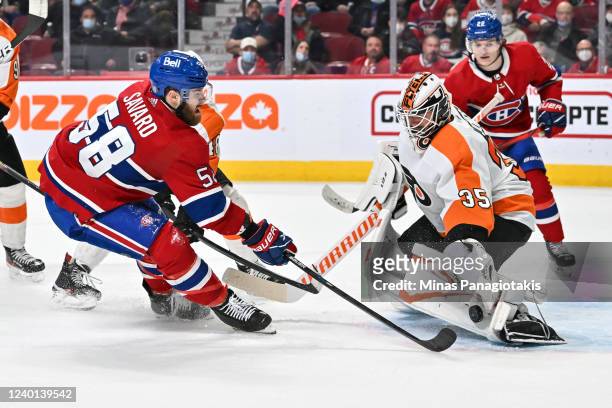 Goaltender Martin Jones of the Philadelphia Flyers makes a pad save on a shot by David Savard of the Montreal Canadiens during the second period at...