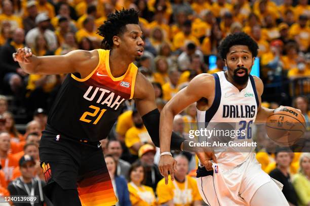 Spencer Dinwiddie of the Dallas Mavericks drives around Hassan Whiteside of the Utah Jazz during the first half of Game Three of the Western...