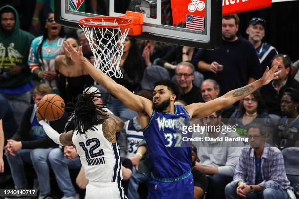 Ja Morant of the Memphis Grizzlies goes up for a shot past Karl-Anthony Towns of the Minnesota Timberwolves in the fourth quarter during Game Three...