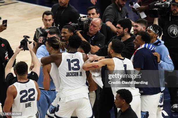 The Memphis Grizzlies celebrate a 104-95 victory against the Minnesota Timberwolves during Game Three of the Western Conference First Round at Target...