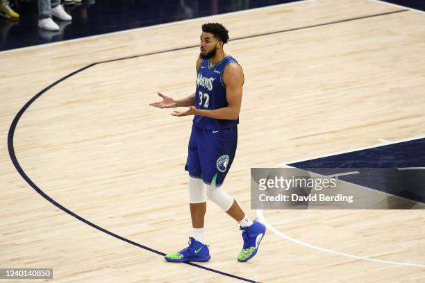 Karl-Anthony Towns of the Minnesota Timberwolves reacts to his three-point basket against the Memphis Grizzlies in the fourth quarter during Game...
