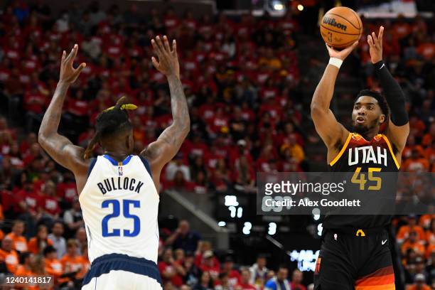 Donovan Mitchell of the Utah Jazz shoots over Reggie Bullock of the Dallas Mavericks during the second half of Game Three of the Western Conference...