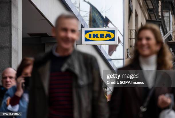 Pedestrians walk past the Swedish Ikea furniture company store in Spain.