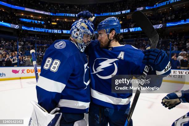 Goalie Andrei Vasilevskiy and Ryan McDonagh of the Tampa Bay Lightning celebrate the win against the Toronto Maple Leafs at Amalie Arena on April 21,...