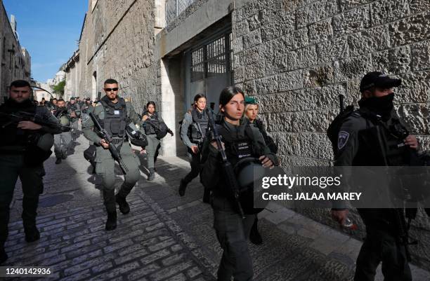 Israeli border police forces take position in Jerusalem's Old City around the Al-Aqsa mosques compound as clashes between Palestinian youths and...