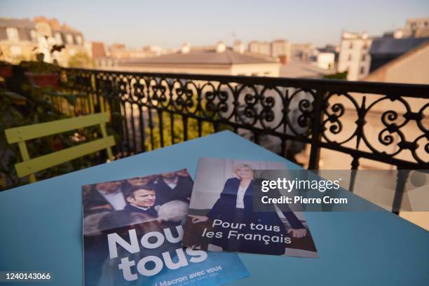 Elections flyers are seen with liberal candidate Emmanuel Macron and far-right candidate Marine Le Pen on April 22, 2022 in Paris, France. French...