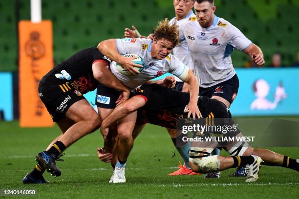 Waratahs player Michael Hooper is tackled during the Super Rugby match between the New South Wales Waratahs and the Waikato Chiefs in Melbourne on...