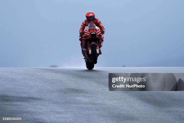 Francesco Bagnaia of Italy and Ducati Lenovo Team Ducati making a wheelie during free practice of Grande Premio Tissot de Portugal at Autodromo do...