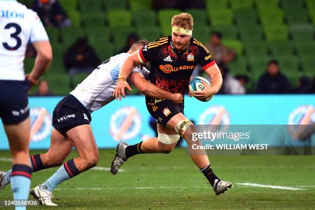 Chiefs player Sam Cane breaks through the Waratahs defenders during the Super Rugby match between the New South Wales Waratahs and the Waikato Chiefs...