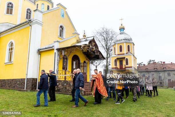 Ukrainian faithful attend Good Friday service in Greek-Catholic church in Nadyby, Lviv Oblast, Ukraine on April 22, 2022. As the Russian Federation...
