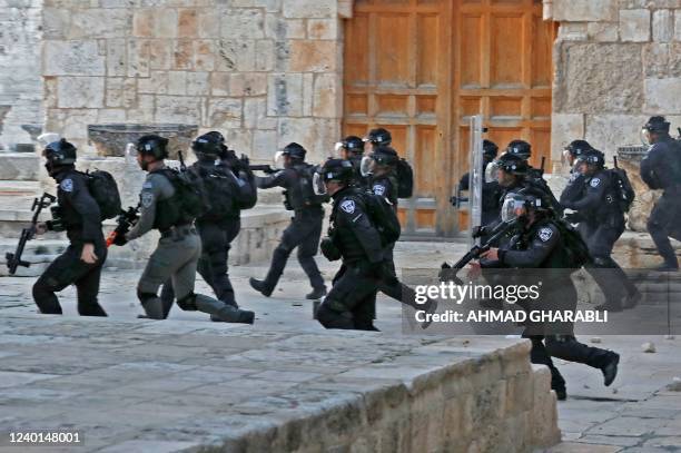 Israeli security forces deploy inside Jerusalem's Al-Aqsa Mosque complex following clashes which broke out in the morning with Palestinian...