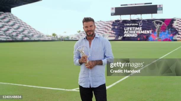 In this handout screengrab released on April 24, David Beckham announces the winner of the Laureus Lifetime Achievement Award during the Laureus...