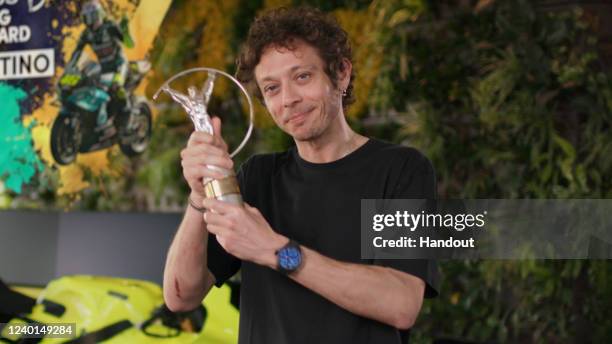 In this handout screengrab released on April 24,Former motorcycle racer Valentino Rossi excepts the trophy for the Laureus Sporting Icon Award during...