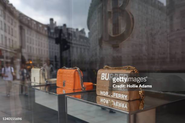 Luxury handbags displayed in a Burberry shop window on Regent Street on April 22, 2022 in London, England. The country's Office of National...