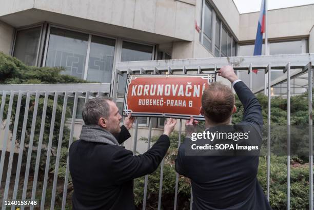 Mayor of the Prague Zdenek Hrib and Ondrej Kolar Mayor of Prague 6 remove old street sign in front of the Russian embassy during renaming ceremony....