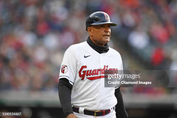 First base coach Sandy Alomar Jr. #15 of the Cleveland Guardians walks to first base during the first inning against the San Francisco Giants at...