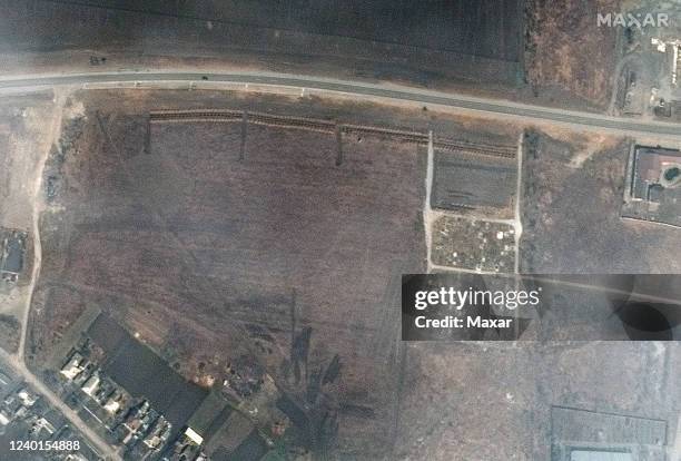 Maxar satellite imagery of the expansion of the mass grave site on the northwestern edge of Manhush, Ukraine. Sequence -- 4 of 5 images. Please use:...