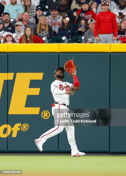 Marcell Ozuna of the Atlanta Braves catches a fly ball in the fifth inning during the game between the Cincinnati Reds and the Atlanta Braves at...