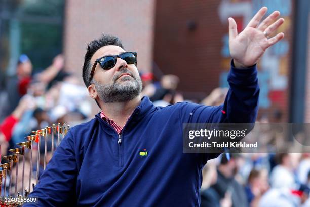 General Manager Alex Anthopoulos of the Atlanta Braves rides in the parade before the game between the Cincinnati Reds and the Atlanta Braves at...