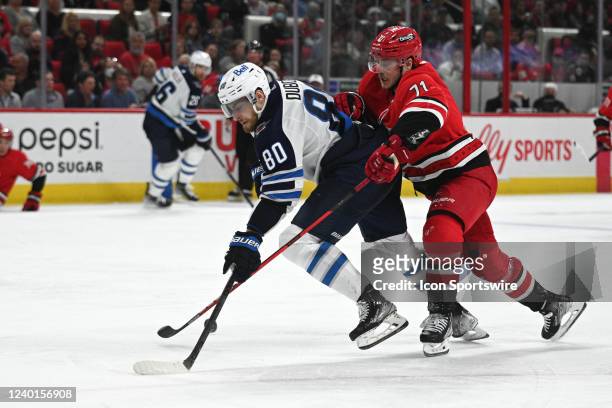 Carolina Hurricanes Right Wing Jesper Fast interrupts a play by Winnipeg Jets Center Pierre-Luc Dubois during the game between the Winnipeg Jets and...