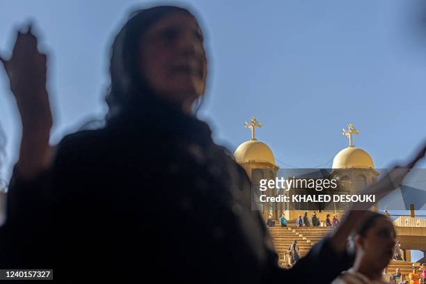 Coptic Orthodox Christians observe Good Friday prayers at the Saint Simon Monastery, also known as the Cave Church, in the Mokattam mountain of...
