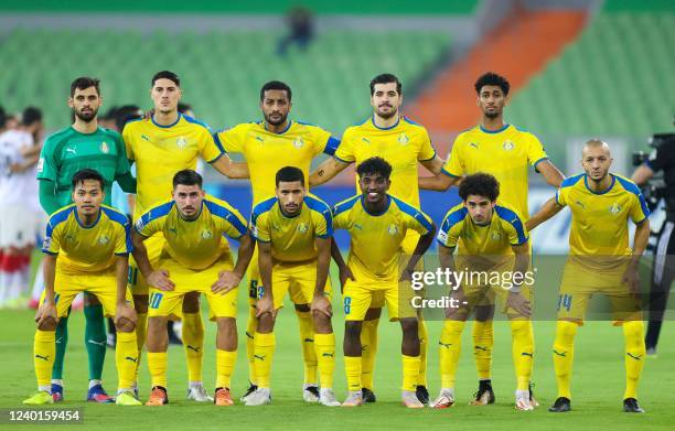 Gharafa's players pose for a group picture ahead of the AFC Champions League group C match between Iran's Foolad and Qatar's al-Gharafa, at the...