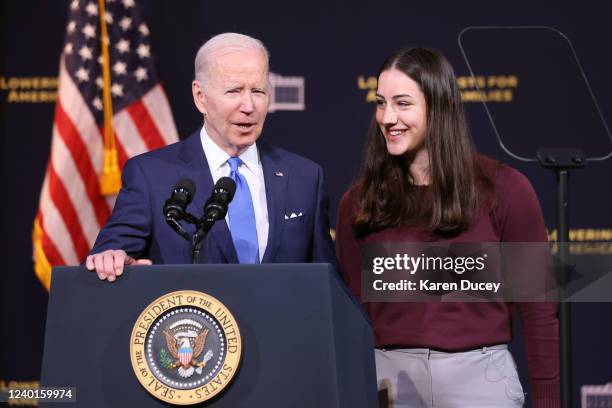 President Joe Biden stands at the podium with Juliana Graceffo, from Sammamish, Washington after she spoke about the high cost of insulin at Green...