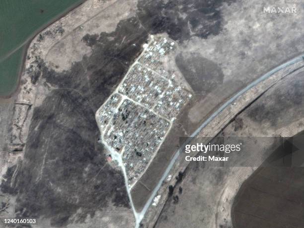 Maxar satellite imagery of another mass grave site expansion justt outside of Vynohradne, Ukraine -- just east of Mariupol. Sequence -- 1 of 4...