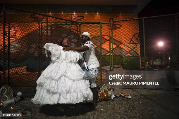 Members of Imperatriz Leopoldinense samba school make last minute arrangements at the concentration area before the first night of carnival parades...