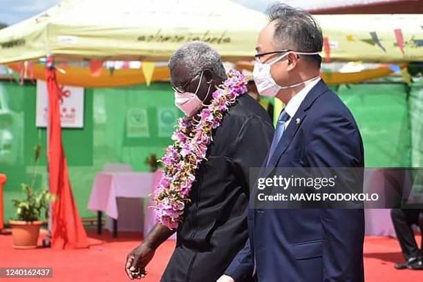 Photo taken on April 22, 2022 shows China's ambassador to the Solomon Islands Li Ming , and Solomons Prime Pinister Manasseh Sogavare attending the...