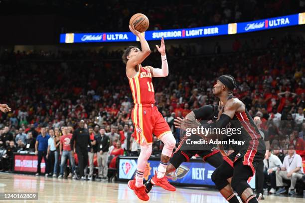 Trae Young of the Atlanta Hawks shoots the ball to win the game during Round 1 Game 3 of the 2022 NBA Playoffs against the Miami Heat on April 22,...