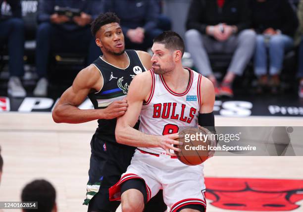 Milwaukee Bucks forward Giannis Antetokounmpo posts up against Chicago Bulls center Nikola Vucevic during Game Three of the Eastern Conference First...