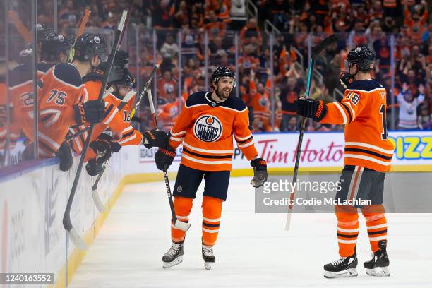 Kris Russell and Zach Hyman of the Edmonton Oilers celebrate a goal against the Colorado Avalanche during the third period at Rogers Place on April...