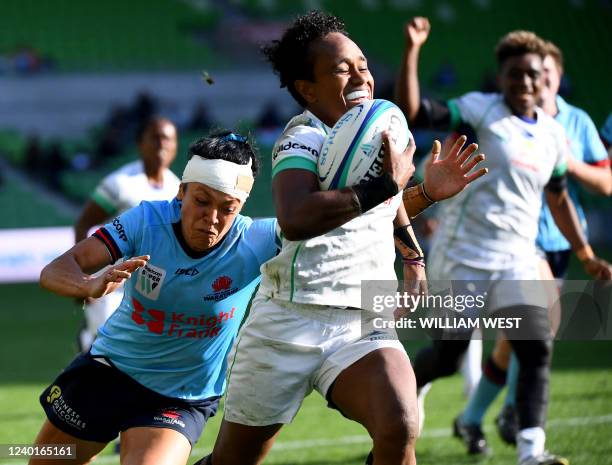 Drua's Timaima Ravisa runs with the ball to score a try in the women's Super Rugby W final match between the New South Wales Waratahs and the Fijiana...