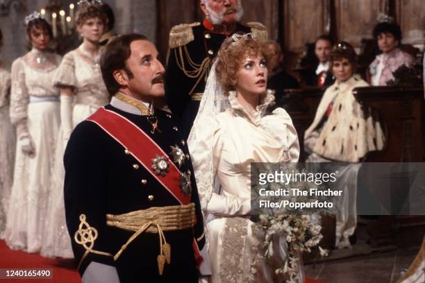 British actors Peter Sellers and Lynne Frederick , who were married in real life, filming a wedding scene for the movie "The Prisoner of Zenda" in...