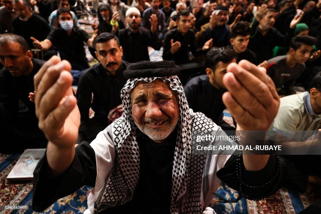 Muslims In Iraq An Iraqi man mourns the 7th century killing of Imam Ali at the Imam ...