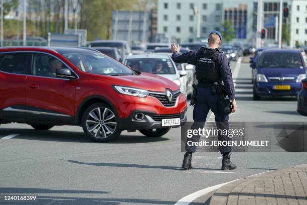 Employee of the Marechaussee controls the traffic near Schiphol airport, near Amsterdam during a strike of KLM personnel handling luggages on April...