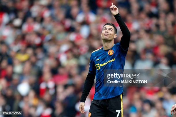 Manchester United's Portuguese striker Cristiano Ronaldo gestures after scoring their first goal during the English Premier League football match...