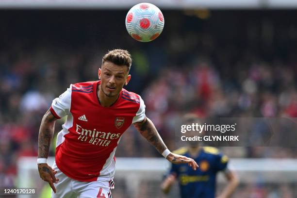 Arsenal's English defender Ben White chases the ball during the English Premier League football match between Arsenal and Manchester United at the...