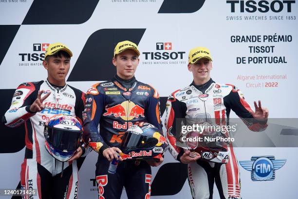 Mario Aji of Indonesia and Honda Team Asia, Deniz Oncu of Turkey and Red Bull Ktm Tech 3 and Lorenzo Fellon of France and SIC58 Squadra Corse during...