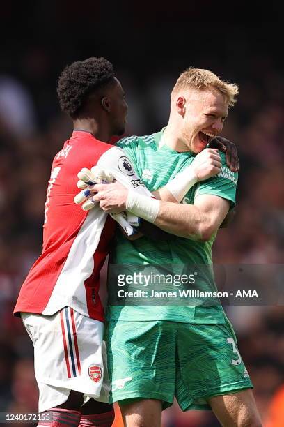 Bukayo Saka and Aaron Ramsdale of Arsenal celebrate at full time of the Premier League match between Arsenal and Manchester United at Emirates...