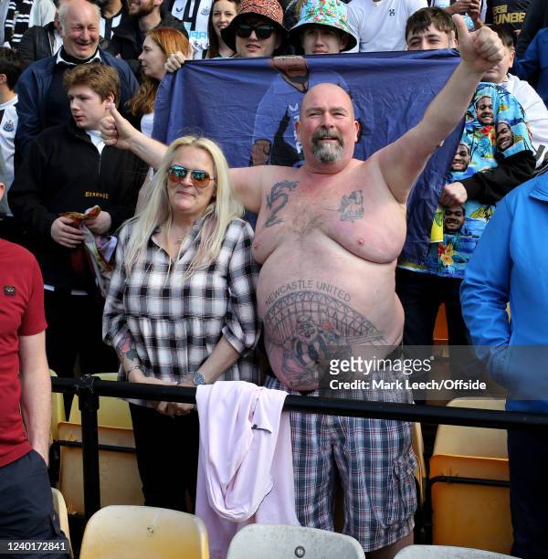 A large Newcastle supporter bares his torso to reveal his tattoos during the Premier League match between Norwich City and Newcastle United at Carrow...