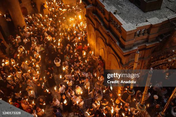 Orthodox Christians attend the "Holy Fire" mass on Holy Saturday ahead the Easter at Church of the Holy Sepulchre in Jerusalem April 23, 2022.