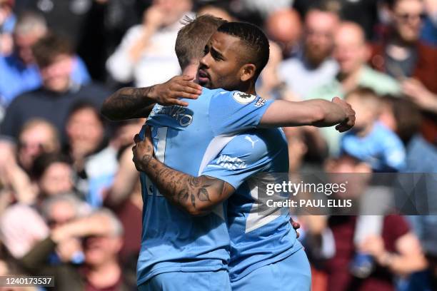 Manchester City's Brazilian striker Gabriel Jesus celebrates with Manchester City's Ukrainian midfielder Oleksandr Zinchenko after scoring the...