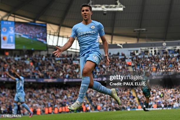 Manchester City's Spanish midfielder Rodri celebrates after scoring their third goal during the English Premier League football match between...