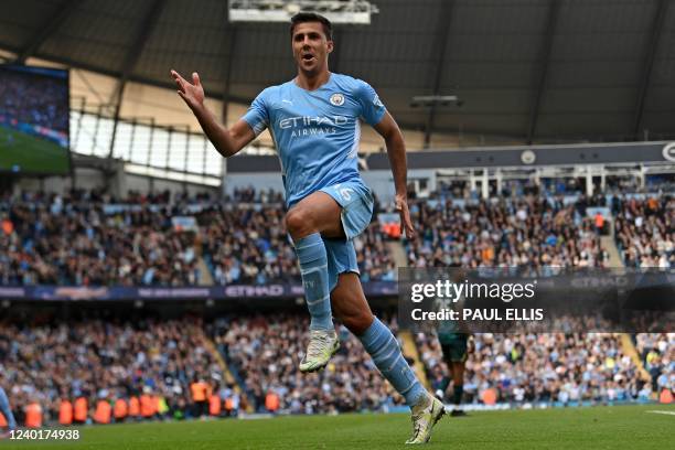 Manchester City's Spanish midfielder Rodri celebrates after scoring their third goal during the English Premier League football match between...