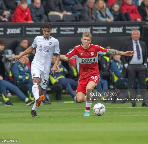 Middlesbrough's Riley McGree vies for possession with Swansea City's Kyle Naughton during the Sky Bet Championship match between Swansea City and...