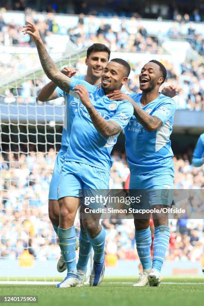 Gabriel Jesus of Manchester City celebrates with Raheem Sterling of Manchester City and Joao Cancelo of Manchester City after scoring their 4th goal...