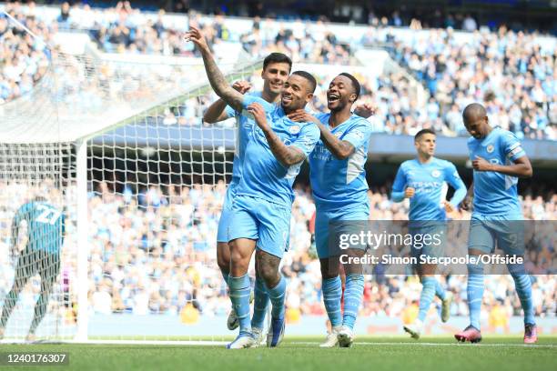 Gabriel Jesus of Manchester City celebrates with Raheem Sterling of Manchester City and Joao Cancelo of Manchester City after scoring their 4th goal...